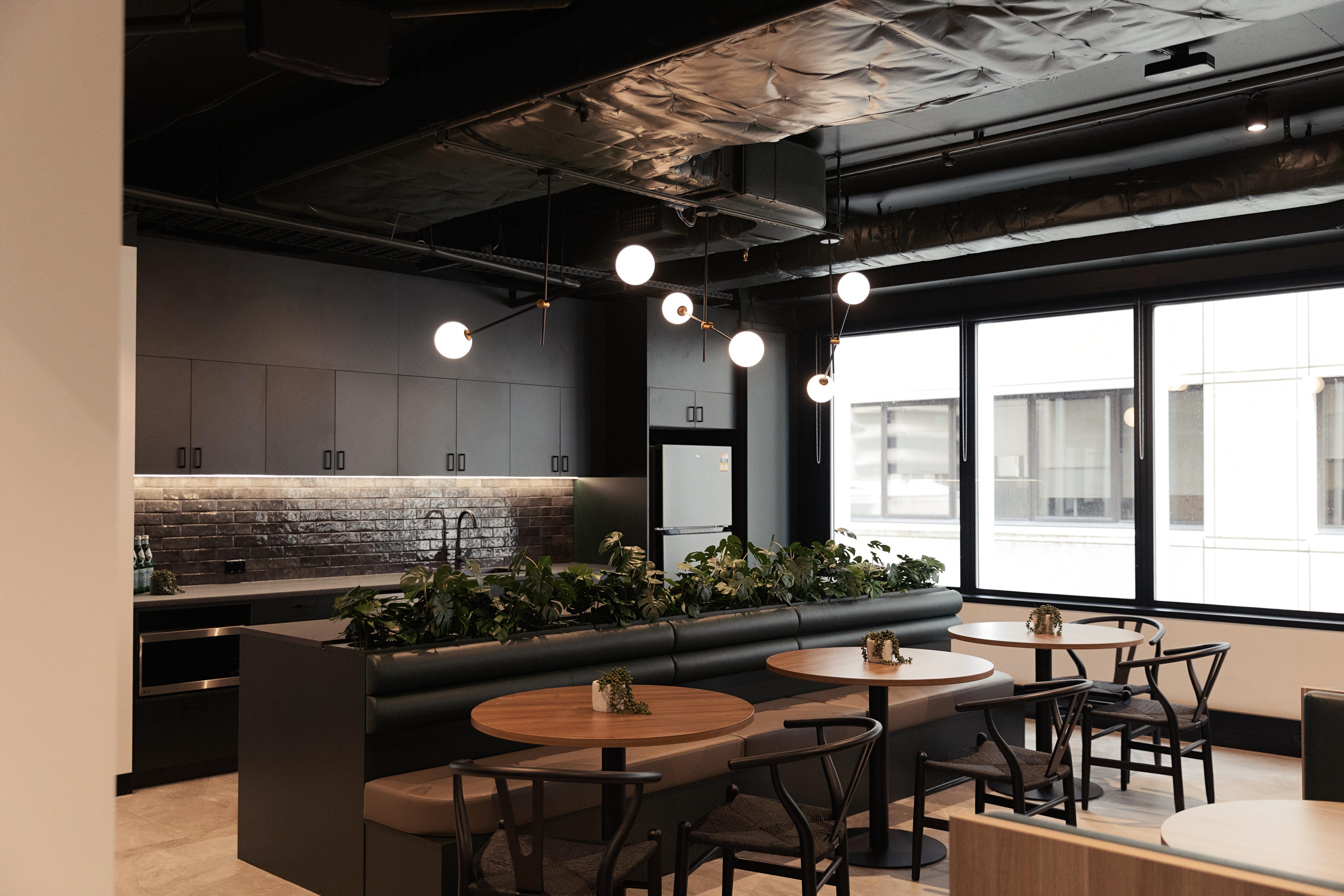 dark tones kitchen with exposed ceiling