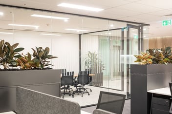 black office furniture looking into a boardroom with glass partitions