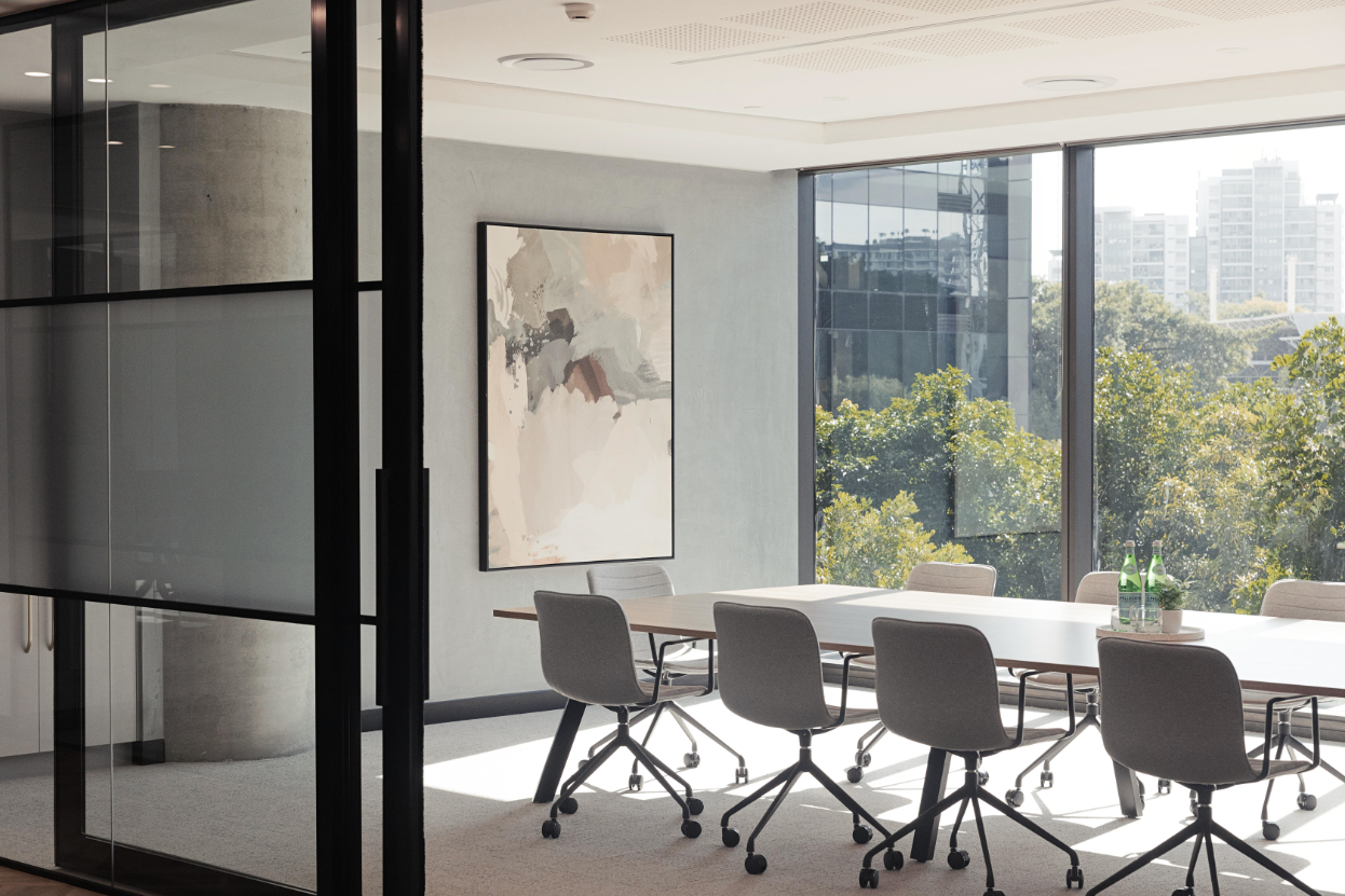 boardroom with 4 chairs and sun shining through