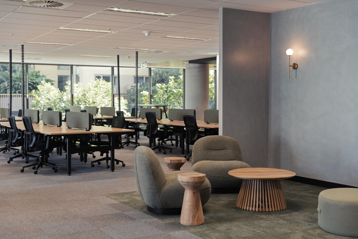 collaborative office area with single chairs around a wooden table