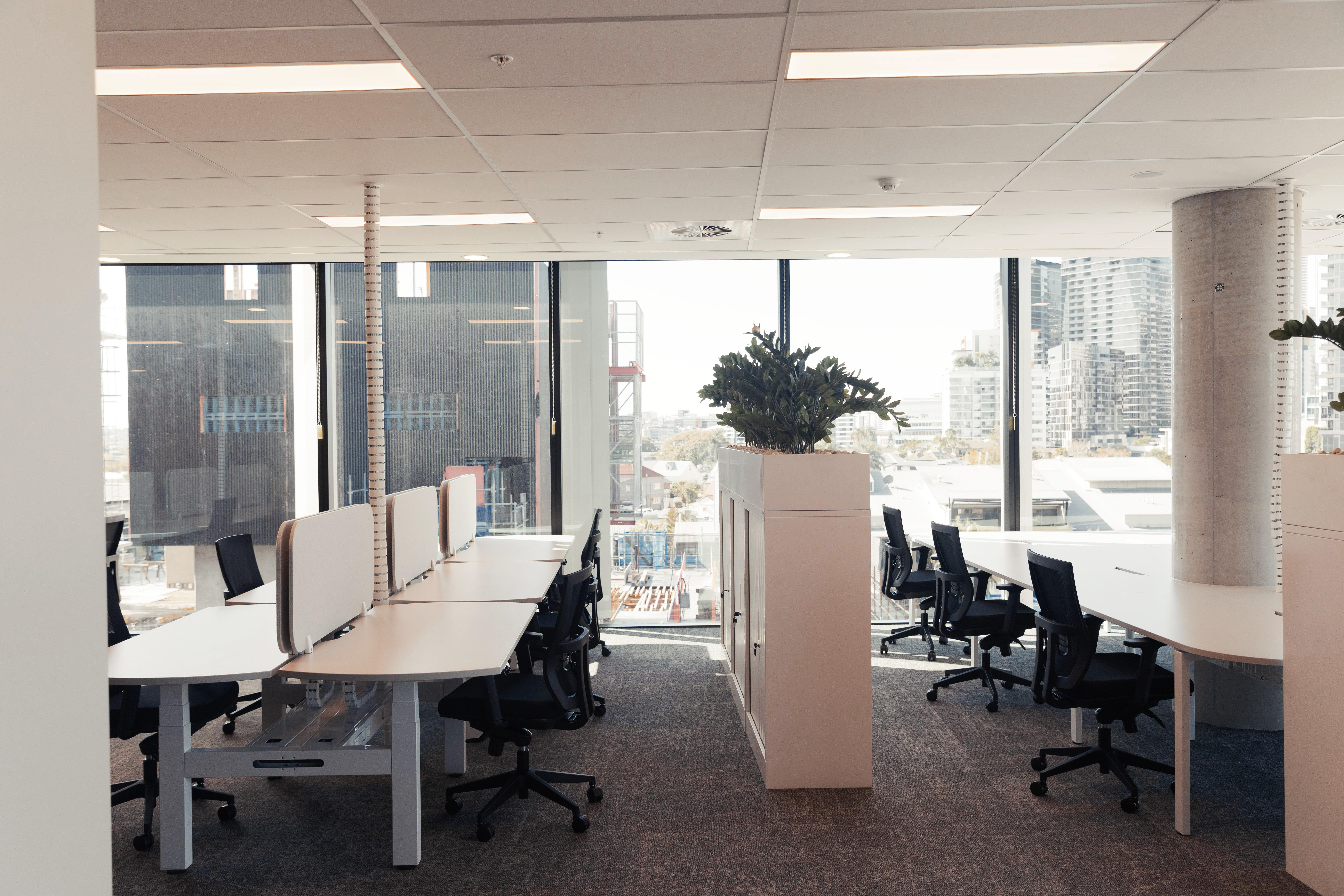 open plan workspace with light coloured furniture
