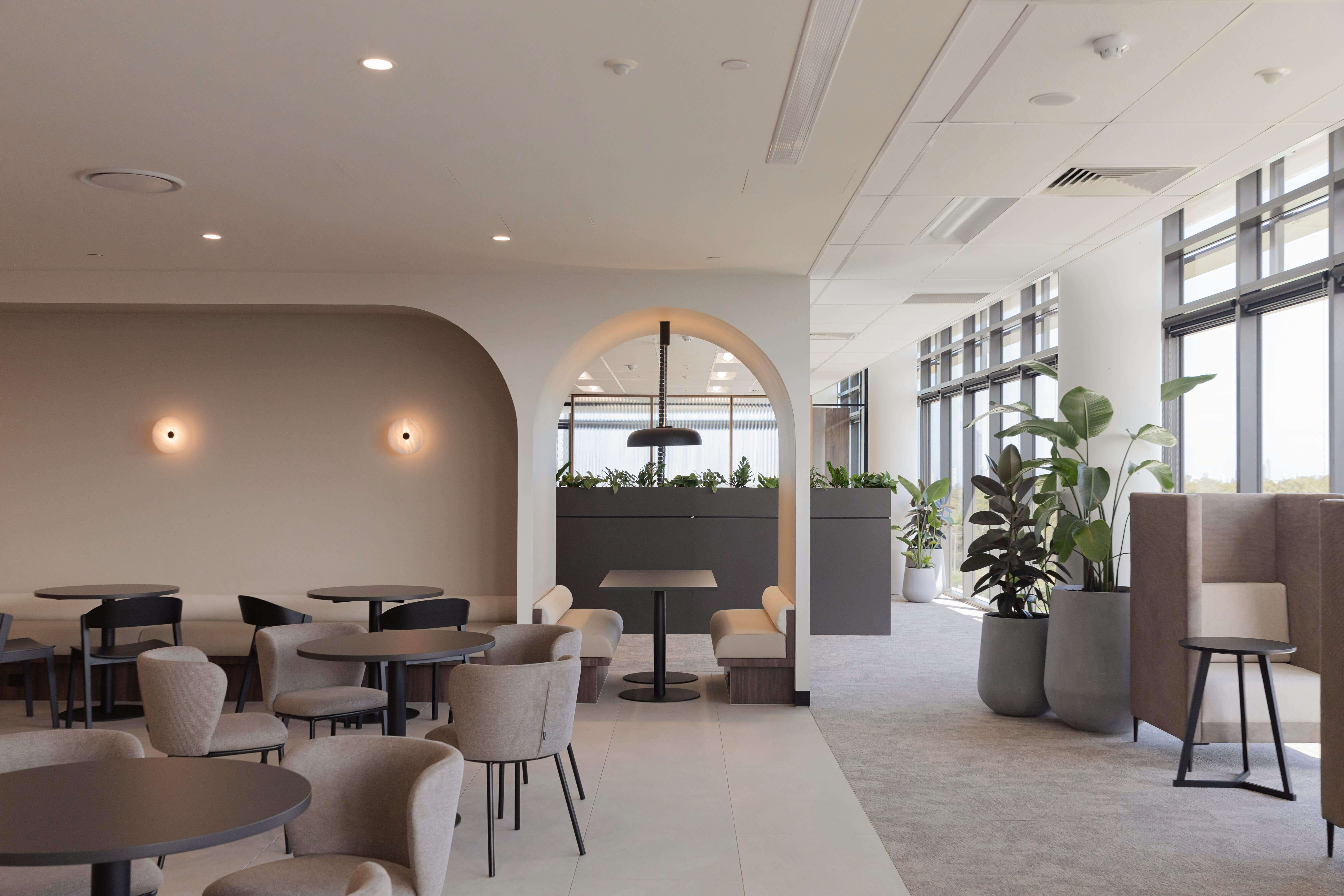 common seating area with archway over a booth seat
