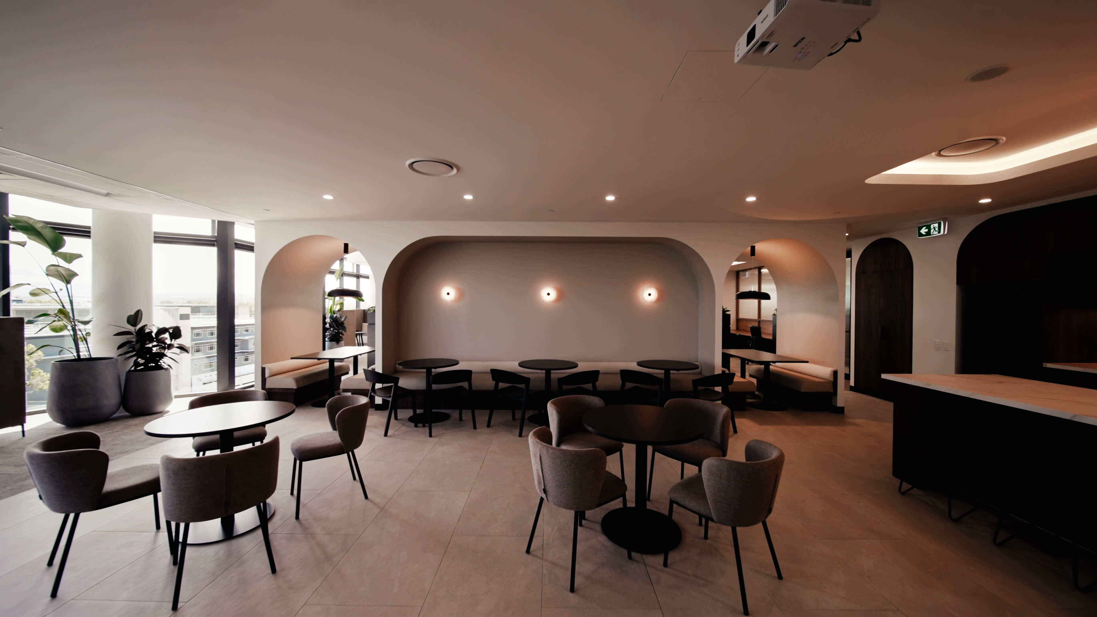 breakout space with arched wall booth seat area