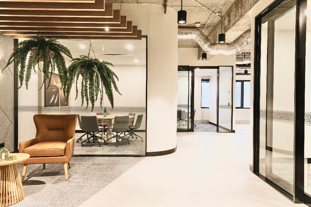 curved wall looking through a thoroughfare of an office